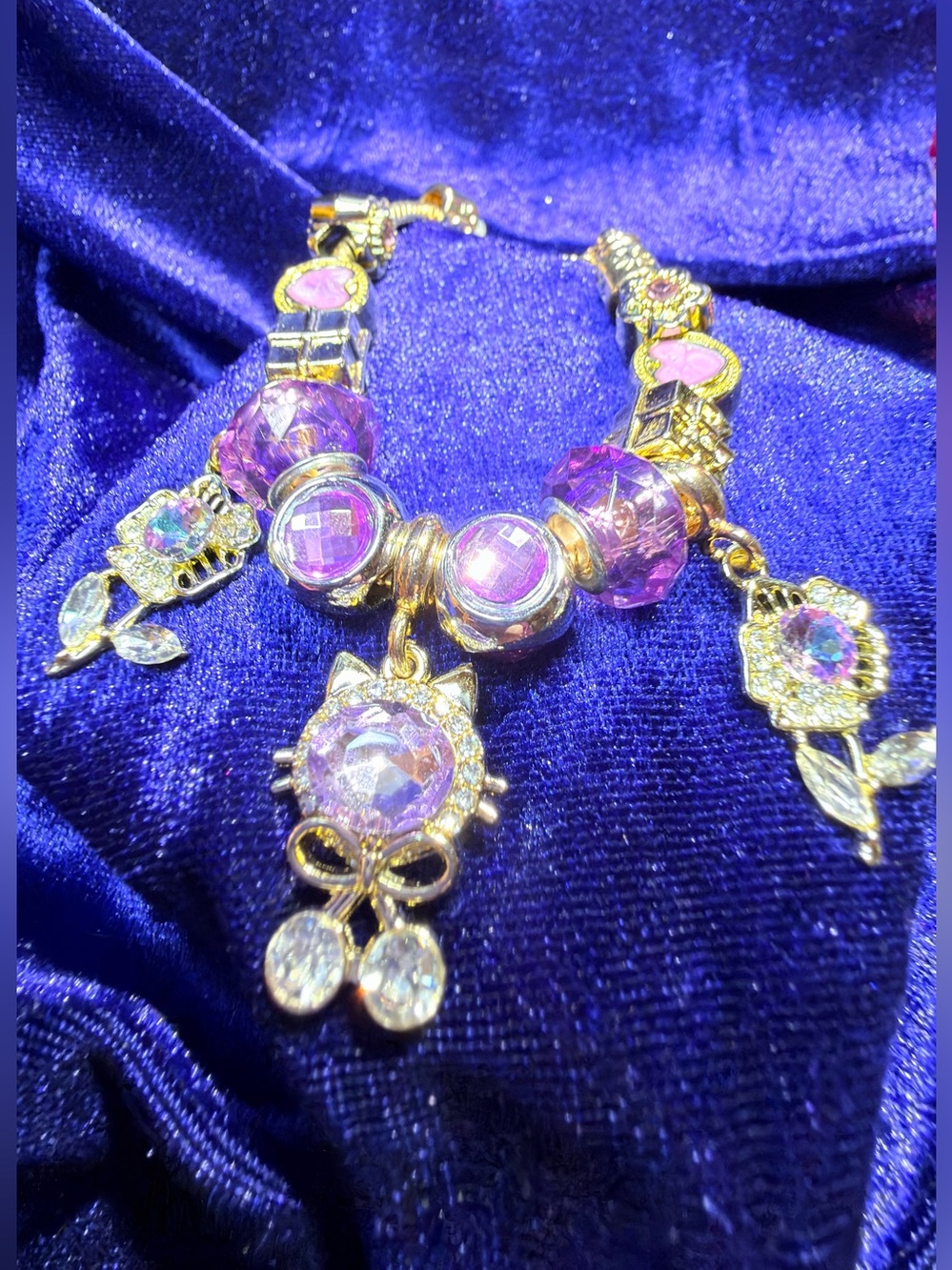 Gold-Tone Purple Crystal Charm Bracelet with Floral Dangles